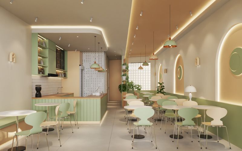 Quán trà sữa 40m2 với gam màu be - xanh hiện đại, nhấn điểm đèn thả
