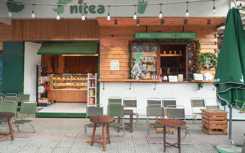 Quán trà sữa take away dễ thương với gam màu xanh rêu bắt mắt